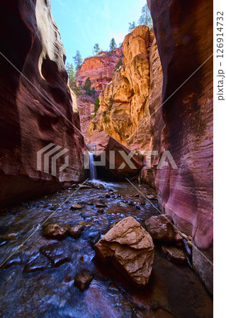 Kanarra Falls Waterfall Motion in Red Rock Slot Canyon Low Angle View 126914732