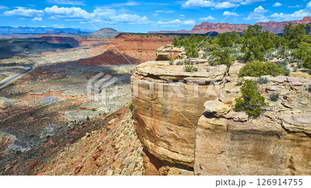 Aerial Fly Over Sandstone Cliffs Desert Canyon and Winding Road Scenic Vista Aerial Fly Over Sandstone Cliffs Desert Canyon and Winding Road Scenic Vista 126914755