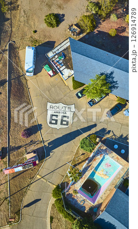 Aerial Route 66 Shield Vintage Motel and Abandoned Pool Top Down Motion 126914789