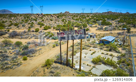 Aerial Abandoned Desert NOTHING Billboard and Graffiti Ruins with Power Lines 126914806