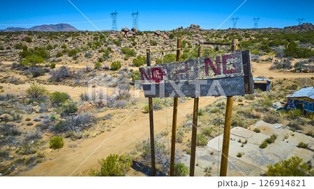 Aerial Abandoned NOTHING Desert Billboard and Graffiti with Power Lines Fly Over Aerial Abandoned NOTHING Desert Billboard and Graffiti with Power Lines Fly Over 126914821