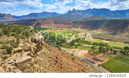 Aerial Red Rock Cliffs Farmland and Desert Valley Motion View Aerial Red Rock Cliffs Farmland and Desert Valley Motion View 126914829