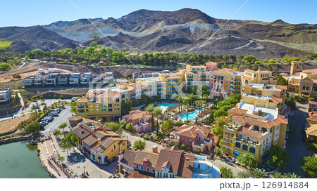 Aerial Resort Community with Lake and Desert Hills Flyover View Aerial Resort Community with Lake and Desert Hills Flyover View 126914884
