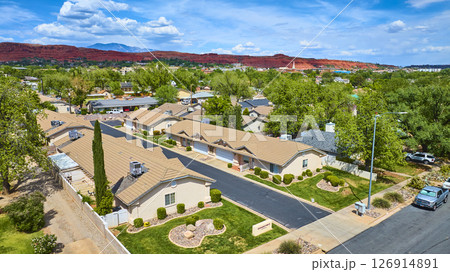 Aerial Suburban Homes and Red Rock Mesas Southwest Community Fly Over Aerial Suburban Homes and Red Rock Mesas Southwest Community Fly Over 126914891