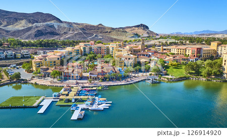 Aerial Waterfront Mediterranean Village and Marina with Desert Mountains Aerial Waterfront Mediterranean Village and Marina with Desert Mountains 126914920