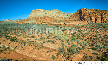 Aerial Fly Over Red Sandstone Cliffs Desert Plain and Rocky Strata in Utah Aerial Fly Over Red Sandstone Cliffs Desert Plain and Rocky Strata in Utah 126914923