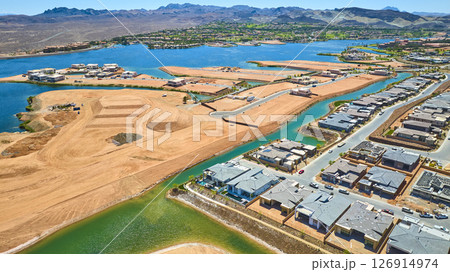 Aerial Waterfront Homes and Construction by Turquoise Lake Fly Through Aerial Waterfront Homes and Construction by Turquoise Lake Fly Through 126914974