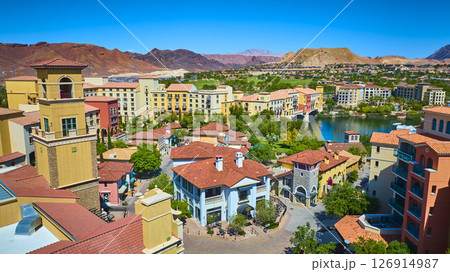 Aerial Vibrant Mediterranean Village Lake and Golf Course Resort Community 126914987