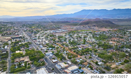 Aerial Small Town Residential Grid and Red Desert Mountains Hurricane Utah 126915057