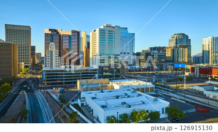 Aerial Downtown Phoenix Skyline Modern High Rises and Light Rail Golden Hour View Aerial Downtown Phoenix Skyline Modern High Rises and Light Rail Golden Hour View 126915130