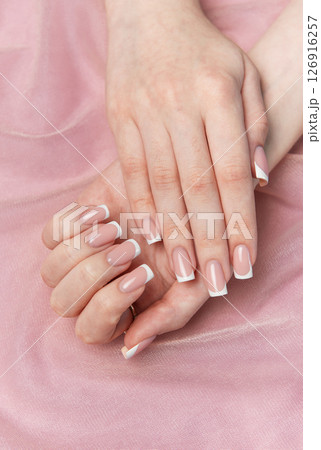 Woman showing french manicure on pink background 126916257