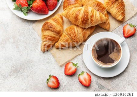 Delicious french breakfast with croissants, coffee and strawberries 126916261
