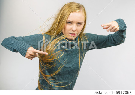 Angry female pointing with fingers 126917067