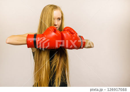 Woman in gloves playing sports boxing 126917088