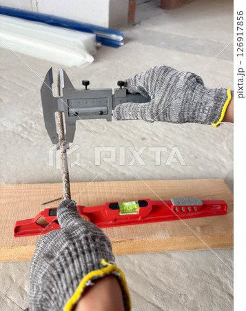 Metal caliper, construction and working measuring tool in the process of measuring the diameter of reinforcement. Metal caliper, construction and working measuring tool in the process of measuring the diameter of reinforcement. 126917856