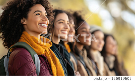 Group of students smiling and looking up in a row outdoors 126919605