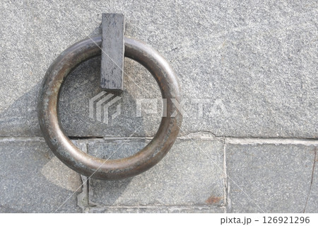 The metal ring in the granite wall symbolizes the chains of non-freedom. 126921296