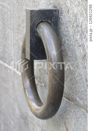 The metal ring in the granite wall symbolizes the chains of non-freedom. The metal ring in the granite wall symbolizes the chains of non-freedom. 126921298