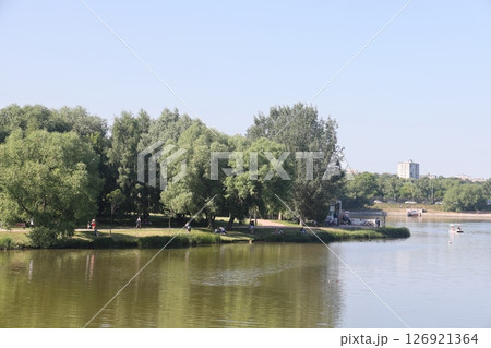 View of the pond and Tsaritsynsky park on a sunny summer day, Moscow, Russia, July 2022. 126921364