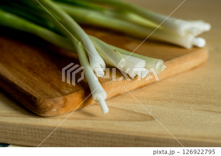 Green onions on a kitchen board Green onions on a kitchen board 126922795