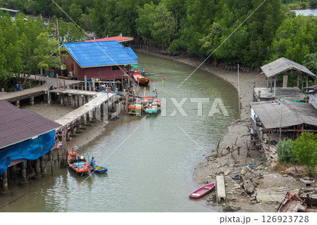 Fishing boats in sea and mangrove forest of Thailand 126923728