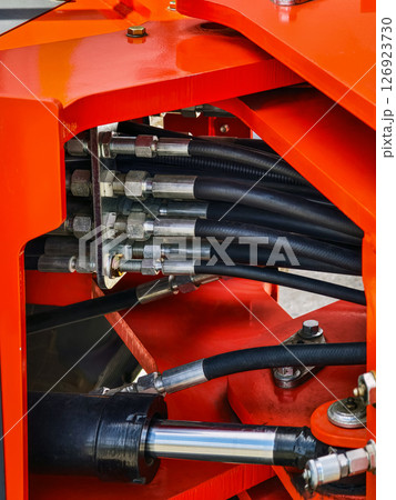 Detailed view of hydraulic system components in heavy machinery 126923730