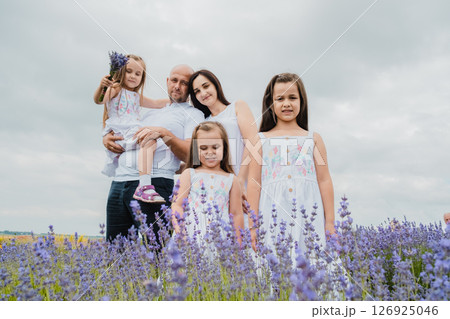 The lavender field surrounds the family with its magical atmosphere 126925046