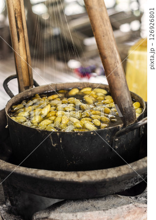 boiling silkworm cocoons traditional silk production method in cambodia 126926801