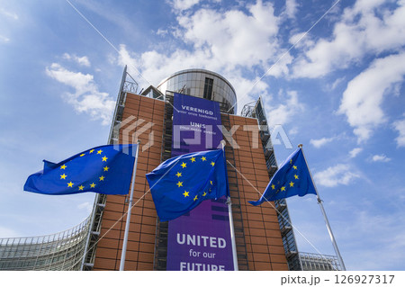 Waving EU flags in front of the Berlaymont building headquarters of the European Commission on May 20, 2025 in Brrussels, Belgium. Waving EU flags in front of the Berlaymont building headquarters of the European Commission on May 20, 2025 in Brrussels, Belgium. 126927317
