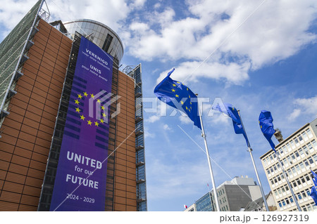Waving EU flags in front of the Berlaymont building headquarters of the European Commission on May 20, 2025 in Brrussels, Belgium. 126927319