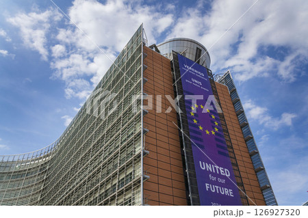 Waving EU flags in front of the Berlaymont building headquarters of the European Commission on May 20, 2025 in Brrussels, Belgium. 126927320