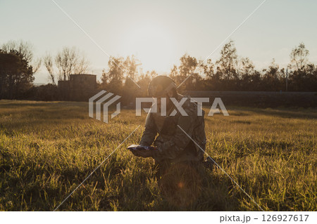 Soldier On His Knees Remembering His Lost Brother Soldier On His Knees Remembering His Lost Brother 126927617