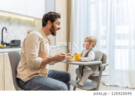 Single father having breakfast with his little baby boy 126928849