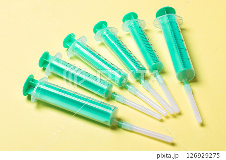 Top view of medical syringes on colorful background. Health care concept with copy space 126929275