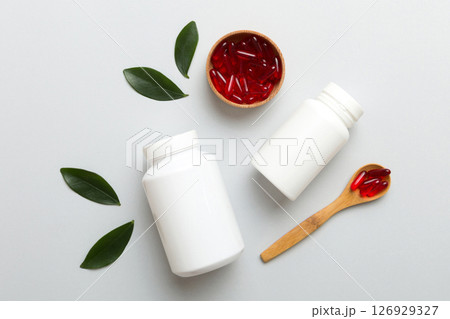 different drugs and health supplement pills with medicine bottle health care and medical top view. Vitamin tablets. Bottle with colored pills on table background. Multivitamins different drugs and health supplement pills with medicine bottle health care and medical top view. Vitamin tablets. Bottle with colored pills on table background. Multivitamins 126929327