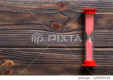 hourglass on the table, sand clock as time passing concept for business deadline, copy space 126929438