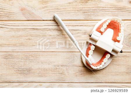 Mouthwash and other oral hygiene products on colored table top view with copy space. Flat lay. Dental hygiene. Oral care kit. Dentist concept Mouthwash and other oral hygiene products on colored table top view with copy space. Flat lay. Dental hygiene. Oral care kit. Dentist concept 126929589