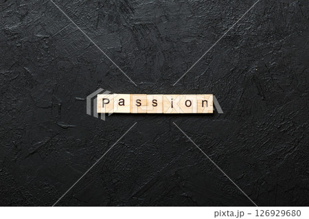 passion word written on wood block. passion text on table, concept passion word written on wood block. passion text on table, concept 126929680