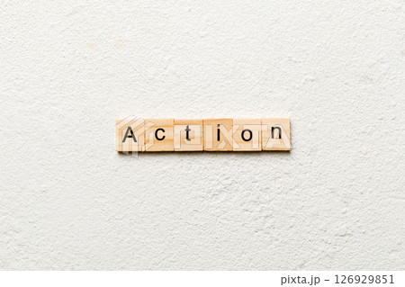 Action word written on wood block. Action text on table, concept Action word written on wood block. Action text on table, concept 126929851