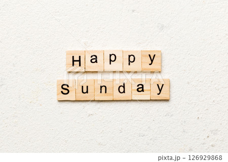 Happy sunday word written on wood block. Happy sunday text on cement table for your desing, concept 126929868