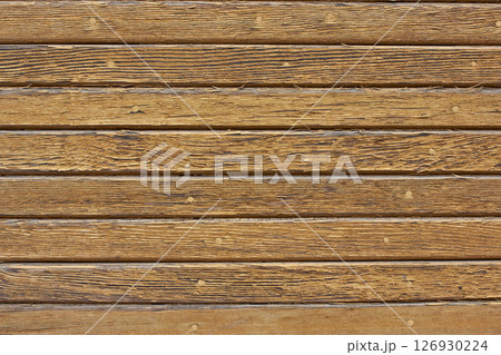 Old wooden background. Wood texture with cracks and worn brown paint. Old wooden background. Wood texture with cracks and worn brown paint. 126930224