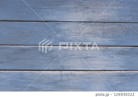 Old wooden background. Wood texture with a shabby blue paint. 126930322