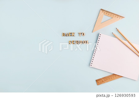 School supplies: an empty notebook, wooden pencils and rulers. 126930593