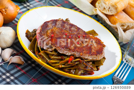 Beef steak with braised vegetables 126930889