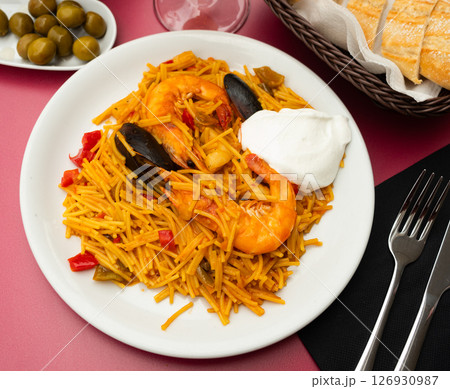 Fideua with seafood served on platter 126930987
