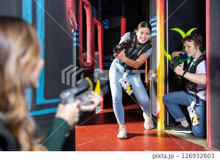 Young woman playing lasertag in arena Young woman playing lasertag in arena 126932603