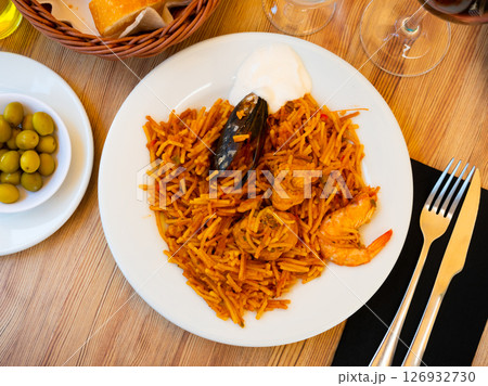 Pasta with seafood contains tiger prawns, shell mussels, spices and chicken fillet Pasta with seafood contains tiger prawns, shell mussels, spices and chicken fillet 126932730