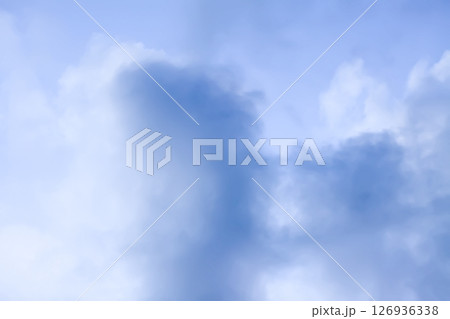 A blue sky with soft clouds. A blue sky with soft clouds. 126936338