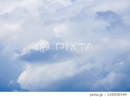 A blue sky with soft clouds. 126936544