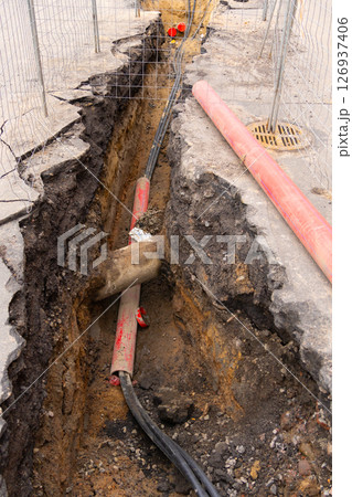 Repair of sewage heating systems or electricity. A trench has been dug in the ground. Repair of sewage heating systems or electricity. A trench has been dug in the ground. 126937406